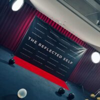 Step and repeat banner with red carpet