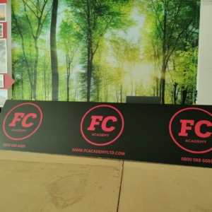 Flat-packed toblerone signage showing assembly and Correx construction
